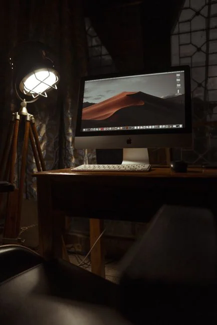 digital Dual monitors on a desk, showcasing web design in a modern office setting.